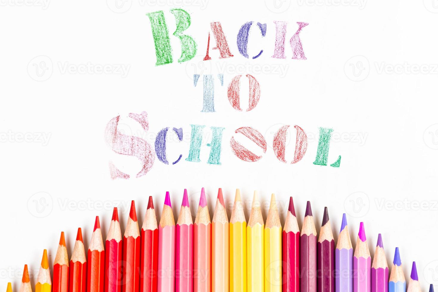 Top view banner message  Back to School  with color pencil Items for the school on white background photo