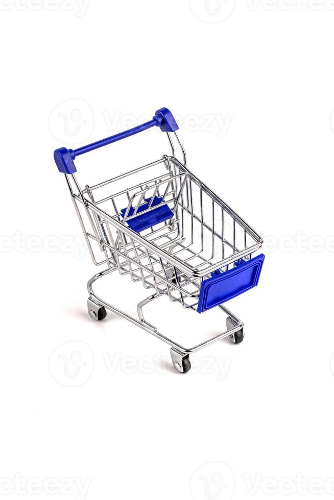 Classic Shopping cart trolley on white background photo