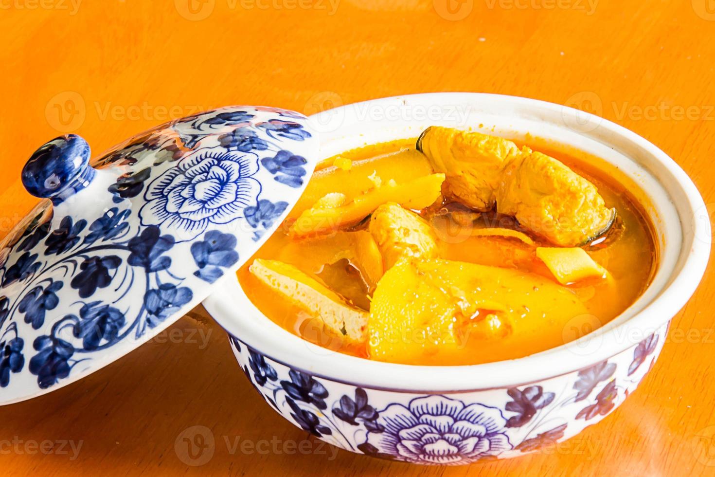 Southern Thai Spicy Sour Yellow Curry with Sea Bass and Coconut Shoots, Sour soup made of Tamarind Paste or Turmeric. photo