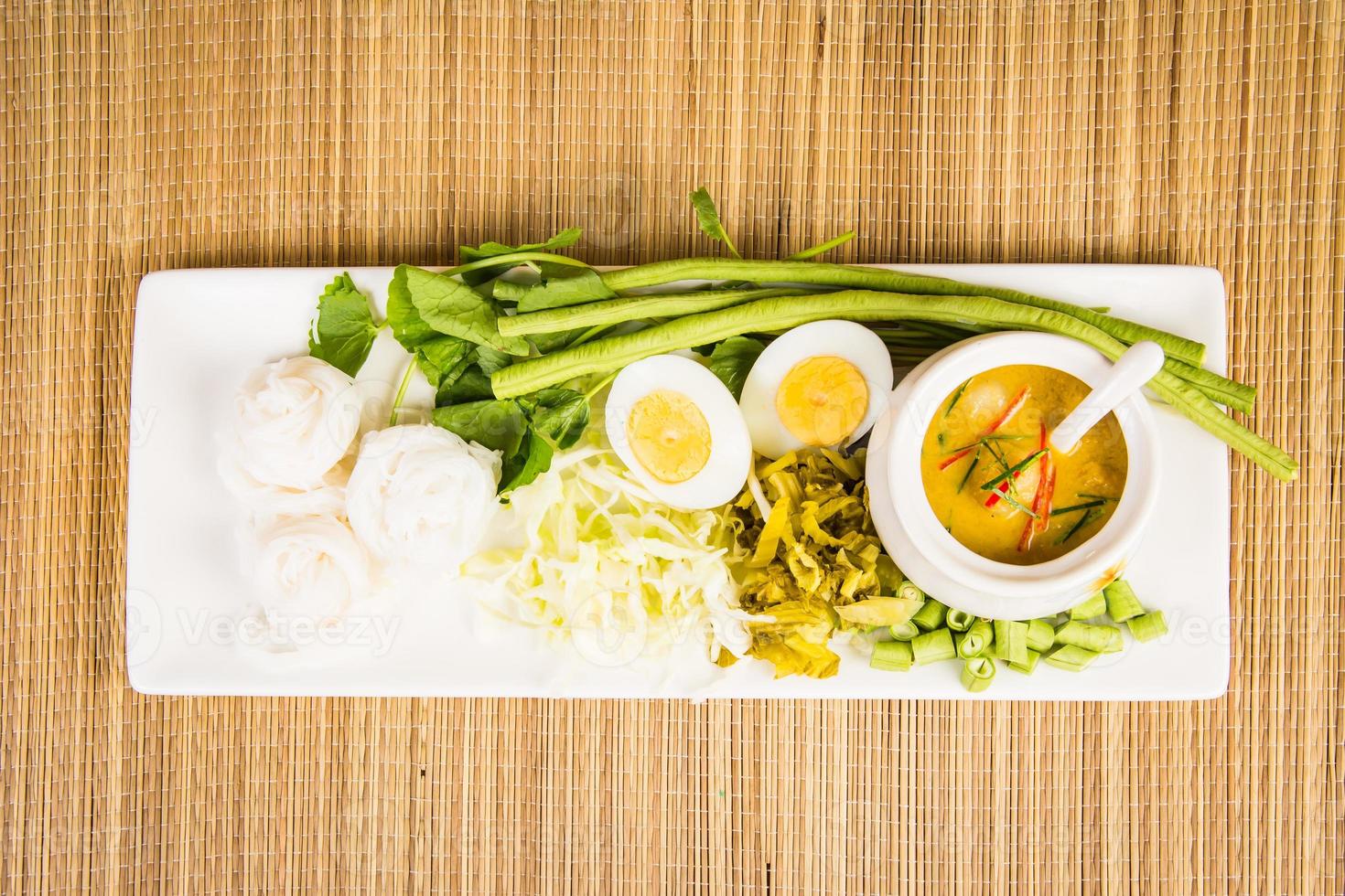 Local Rice vermicelli and curry sauce with vegetable Kanom Jeen Nam Ya photo