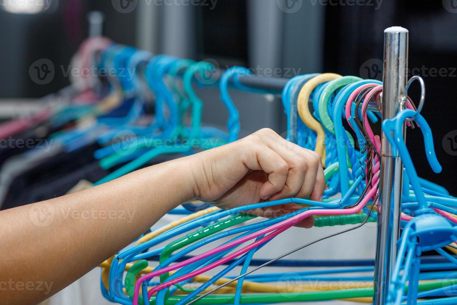 Clothes hangers preparing to dry clothes female hand photo