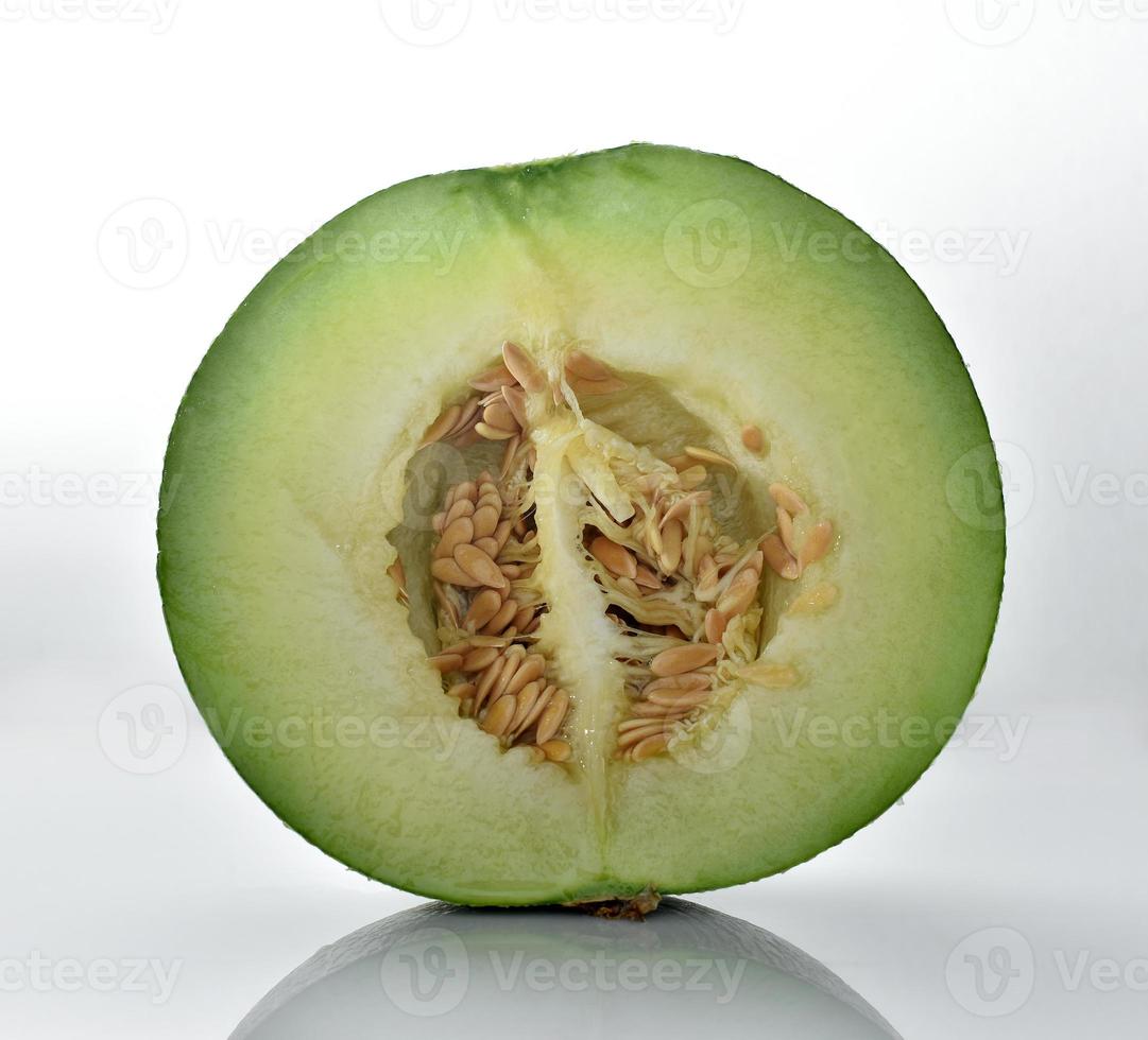 Melon cut in half on a white background. photo