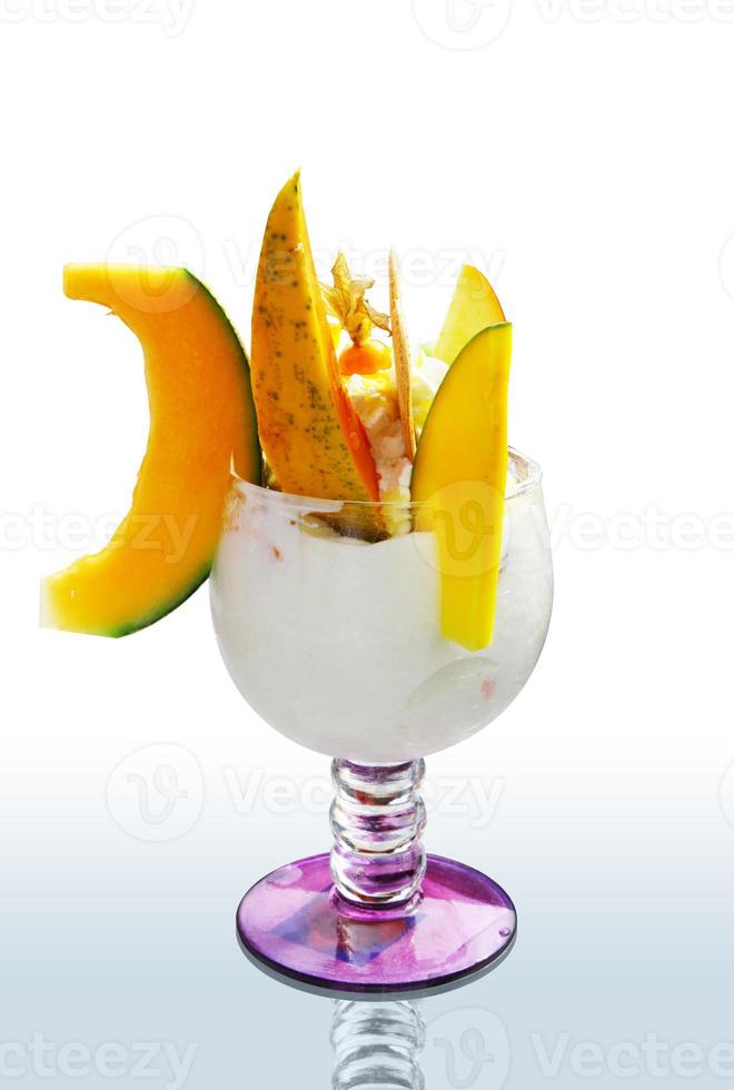 Delicious ice cream with melon and papaya. Healthy summer food concept. photo