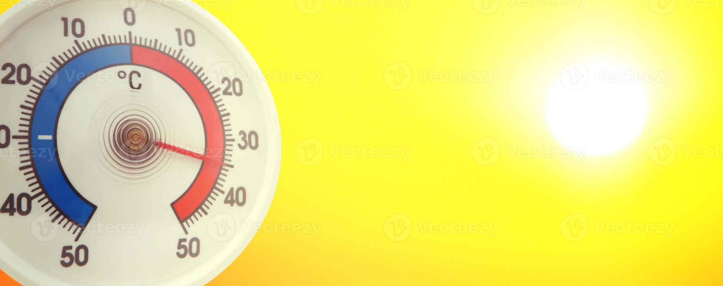 Thermometer with celsius scale showing extreme high temperature. photo