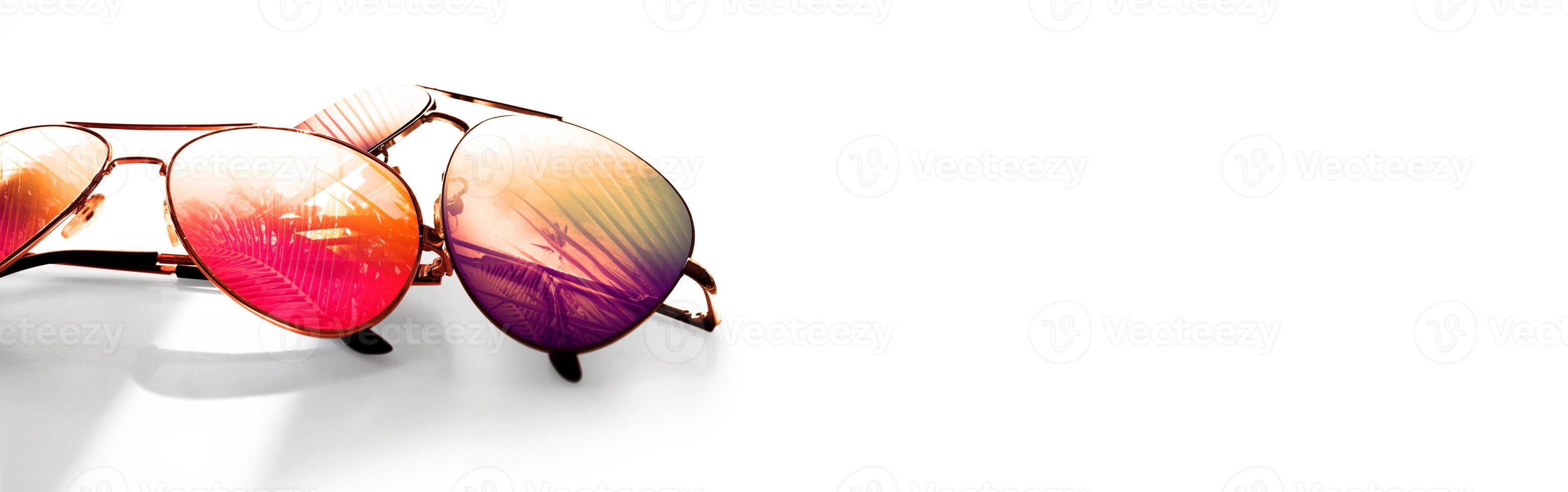 Summer tropical beach background with fashionable sunglasses. photo