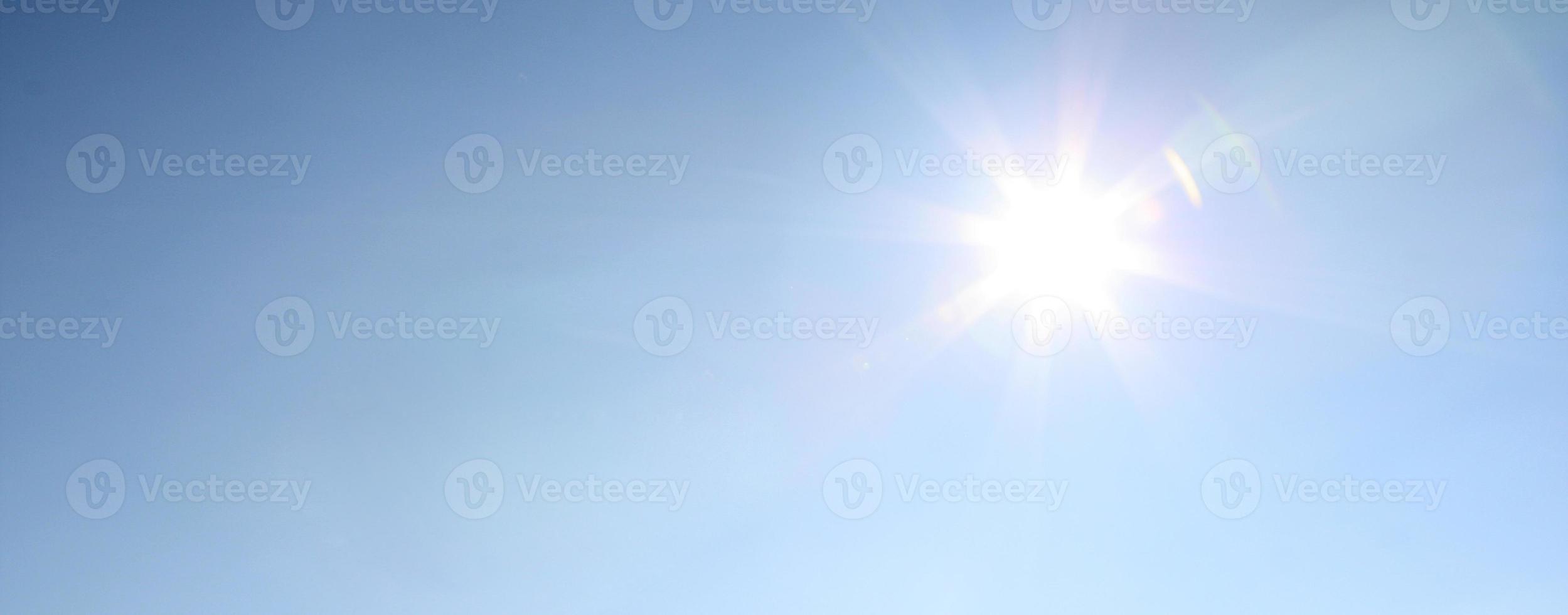 Blue sky during a sunny day with sunlight. photo