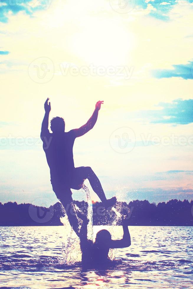 Group of friends having fun on the beach. photo