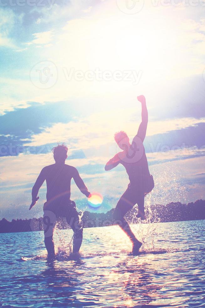 Group of friends having fun on the beach. photo