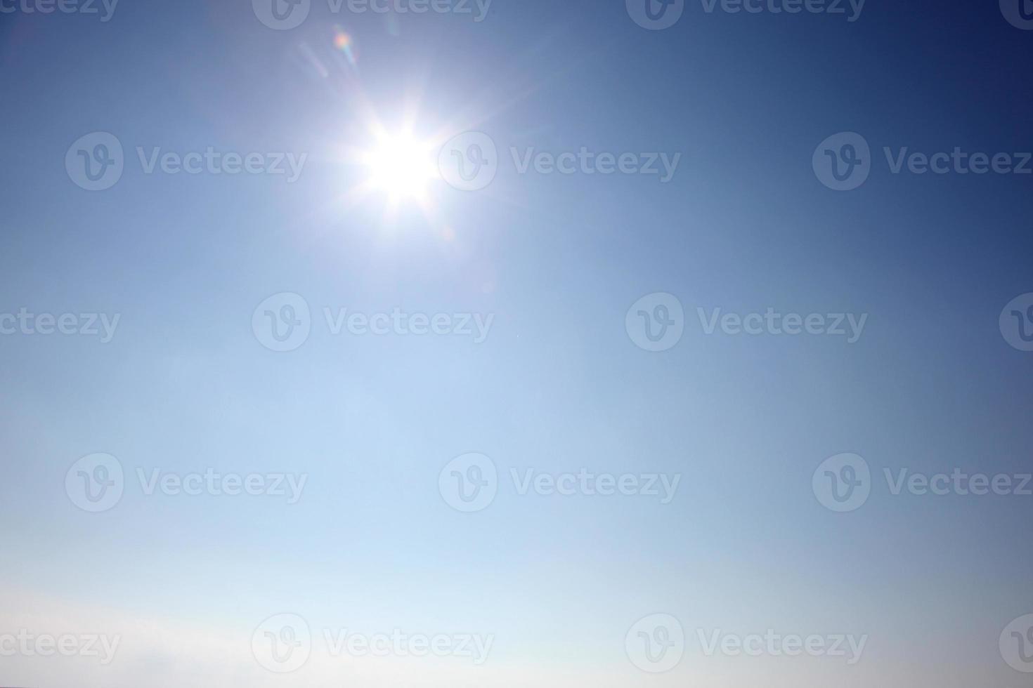 Blue sky during a sunny day with sunlight. photo