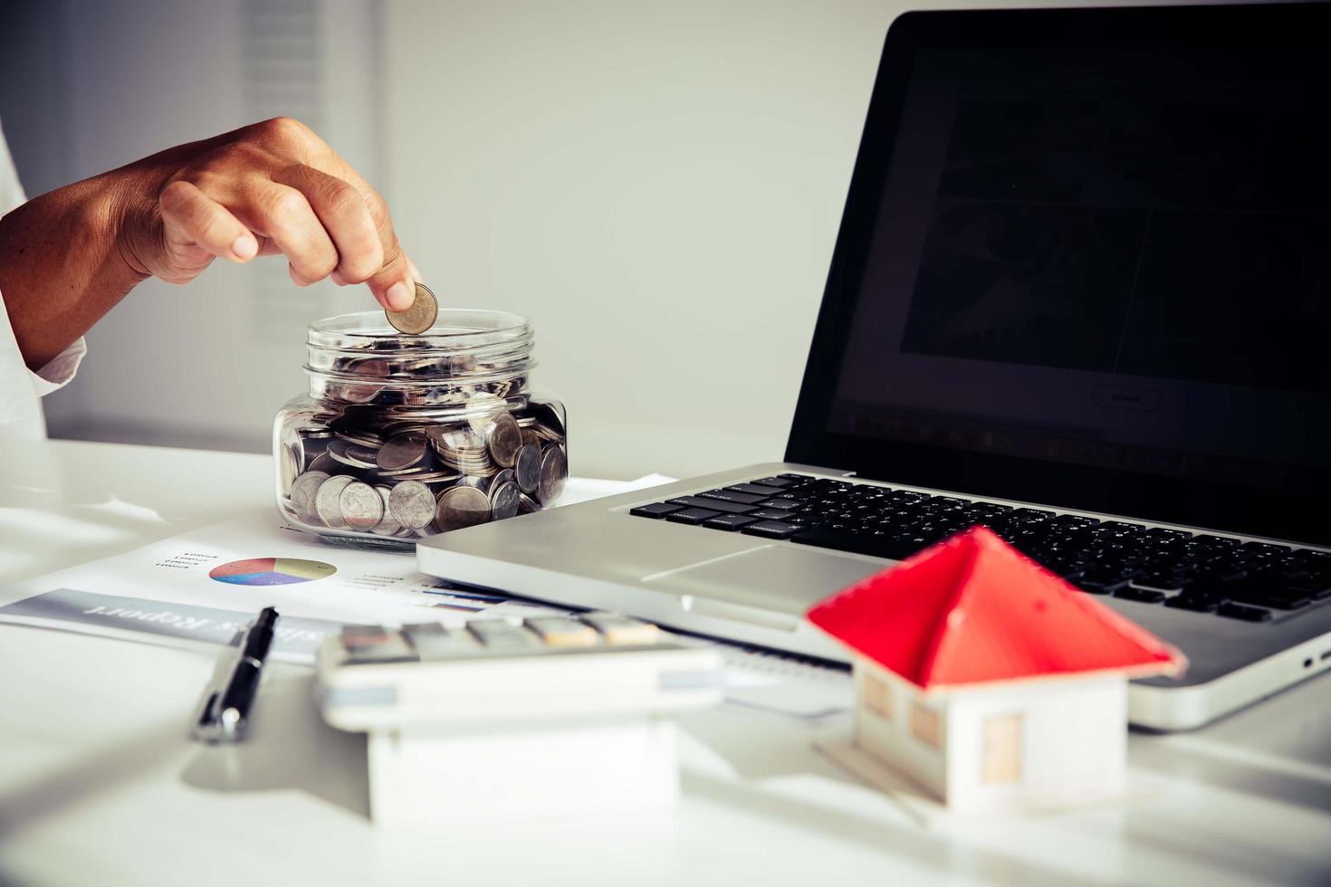 Business man putting coin increase on coins stacking photo