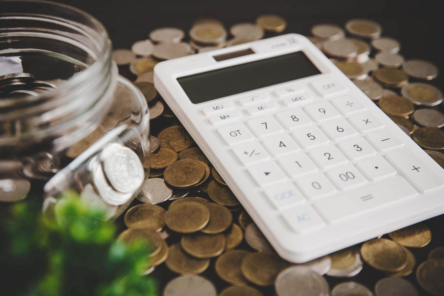 Coins in glass jar for money saving photo