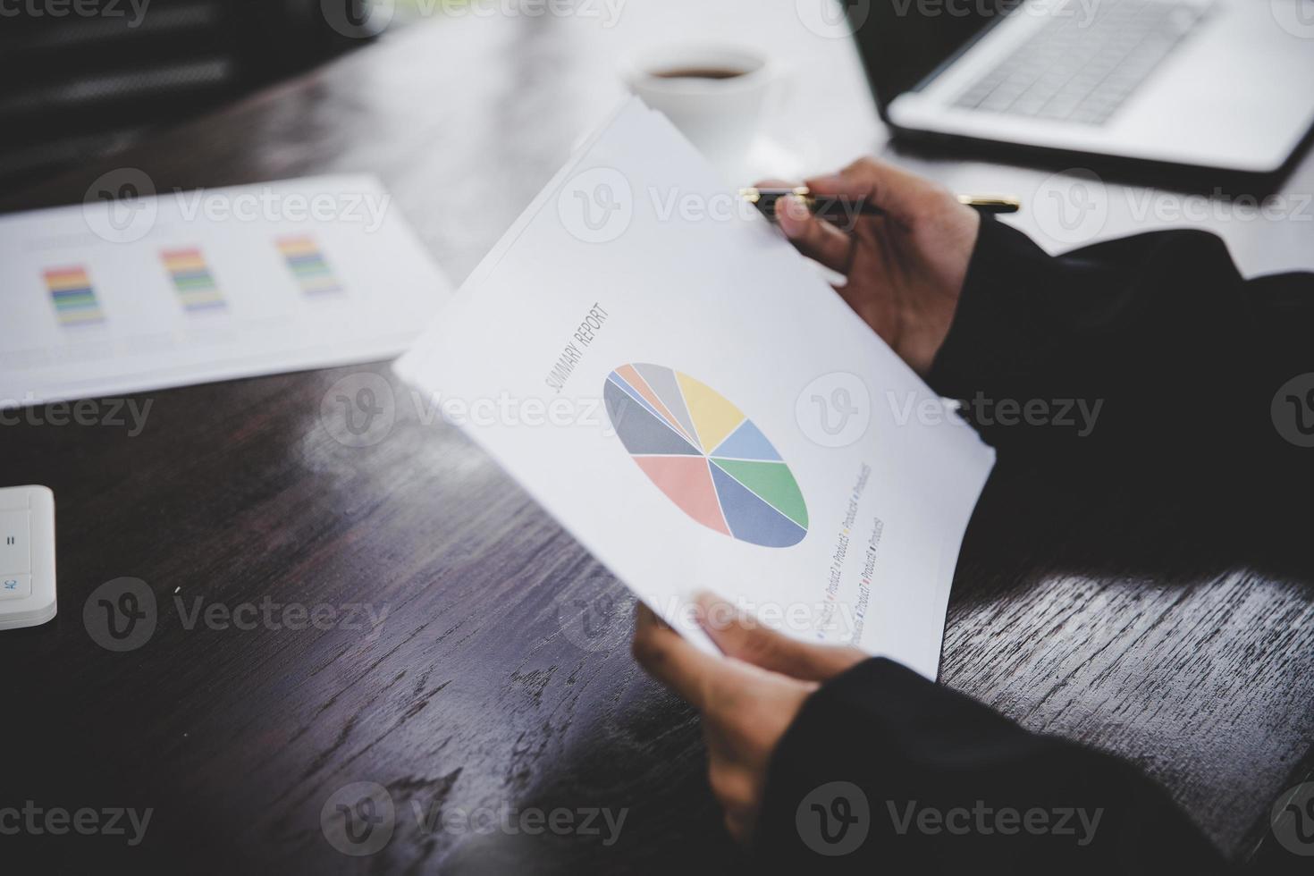 Businessman looking at charts photo