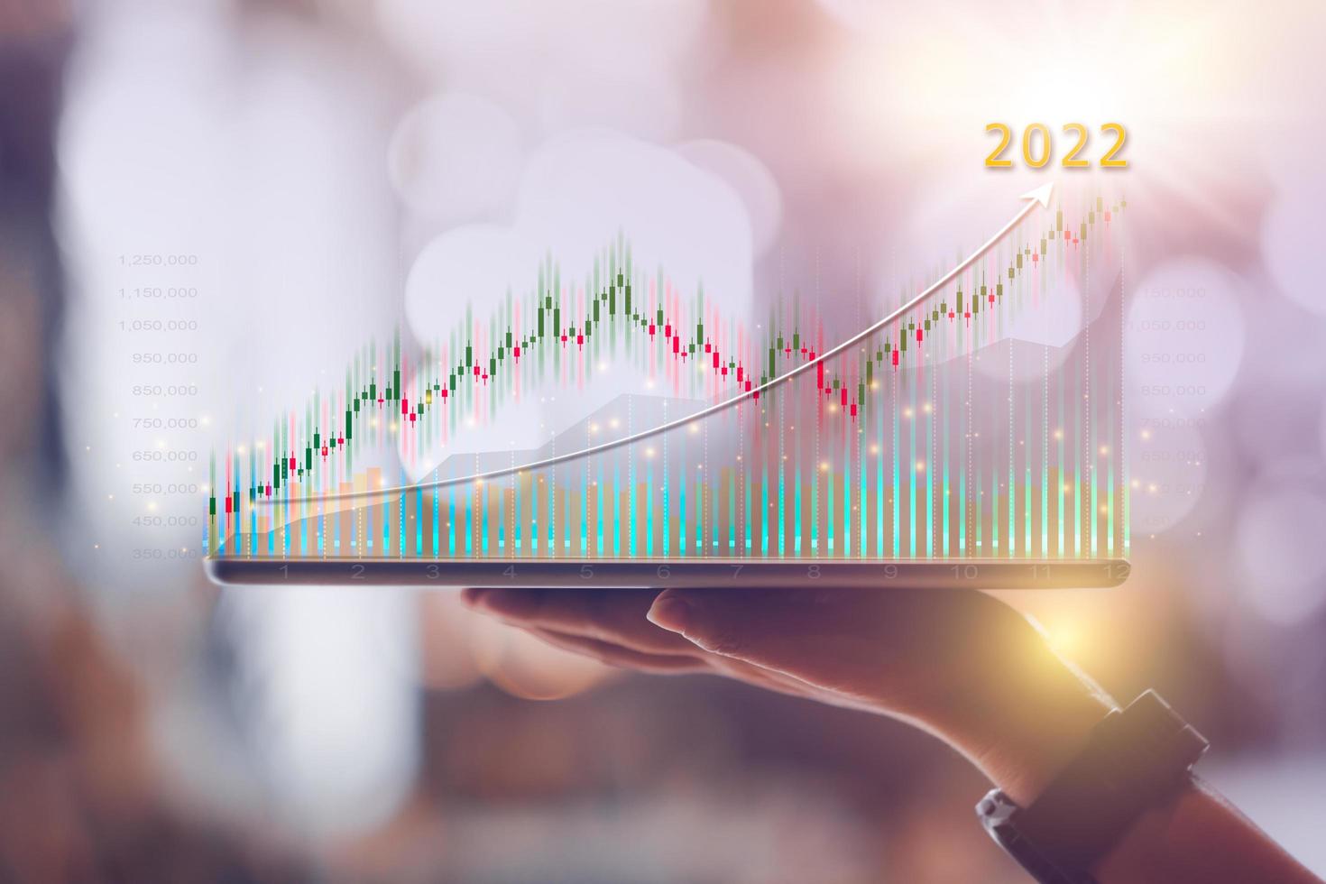 Woman hand showing virtual hologram stock from tablet,2022 business growth concept,Stock market graph or forex trading chart,Planning and strategy,Progress or success,Digital asset,Trader or investor. photo