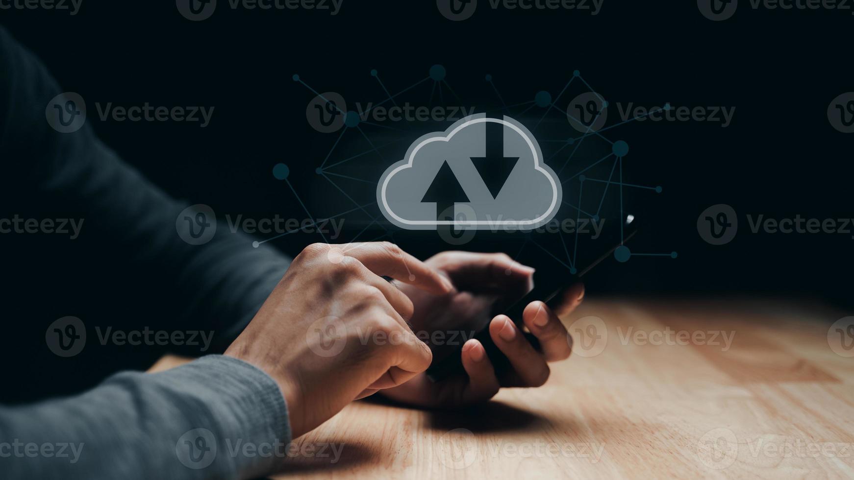 Man using smartphone with virtual cloud computing with connection line.Cloud computing system for sharing download and upload big data information. photo