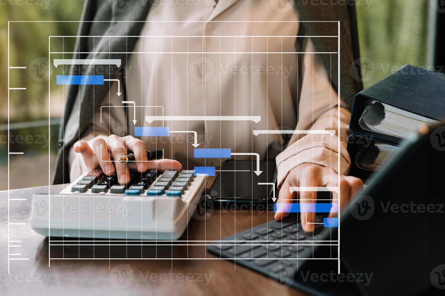 Project manager working and update tasks with milestones progress planning and Gantt chart scheduling diagram. business working with smart phone, tablet and laptop in office. photo