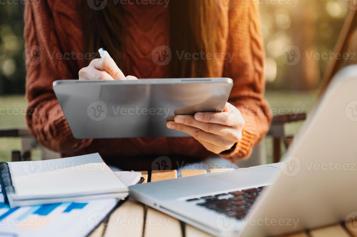 businesswoman hand working with new modern computer and writing on the notepad strategy diagram photo