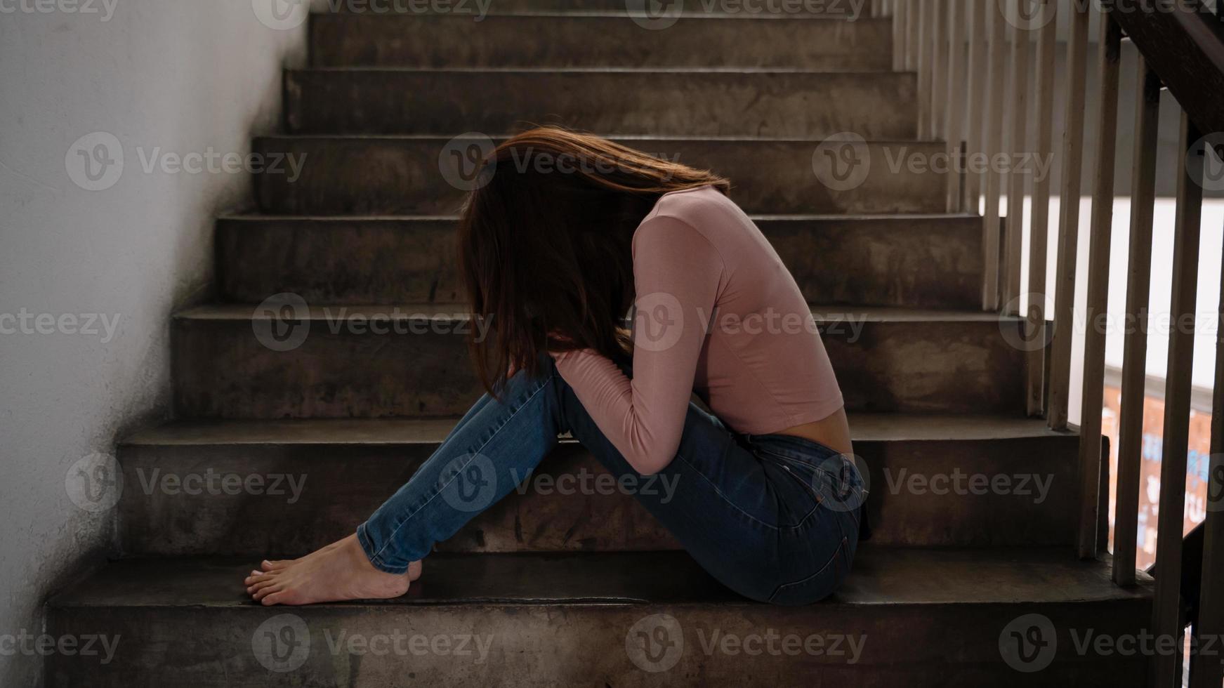 Asian woman sit Depression Standing by window and anxiety Copy space. photo