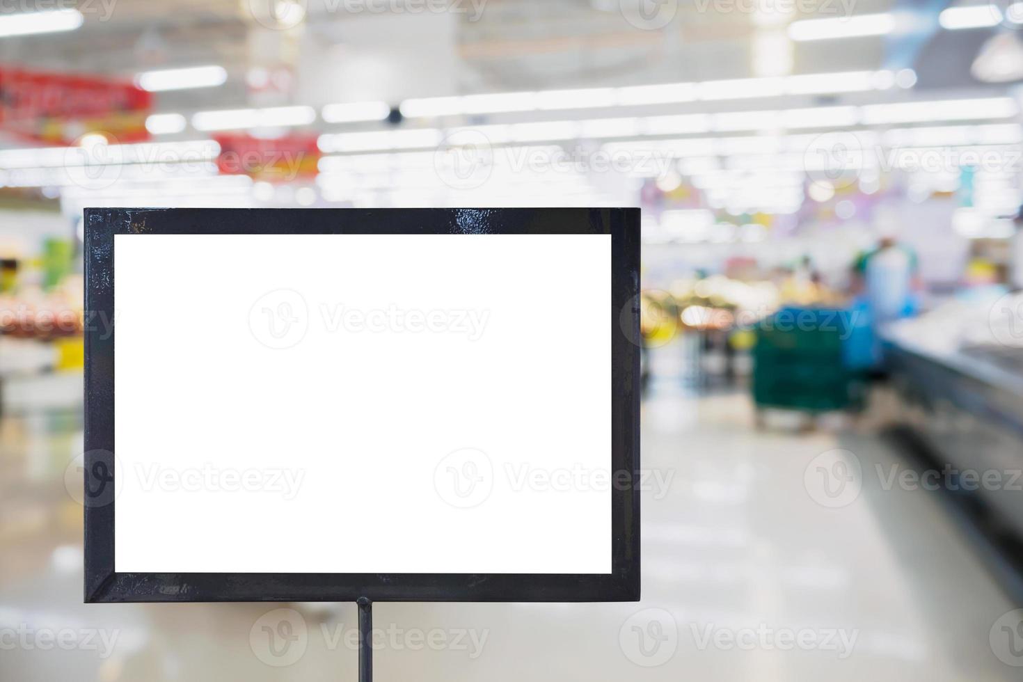 blank board with blur supermarket for background photo