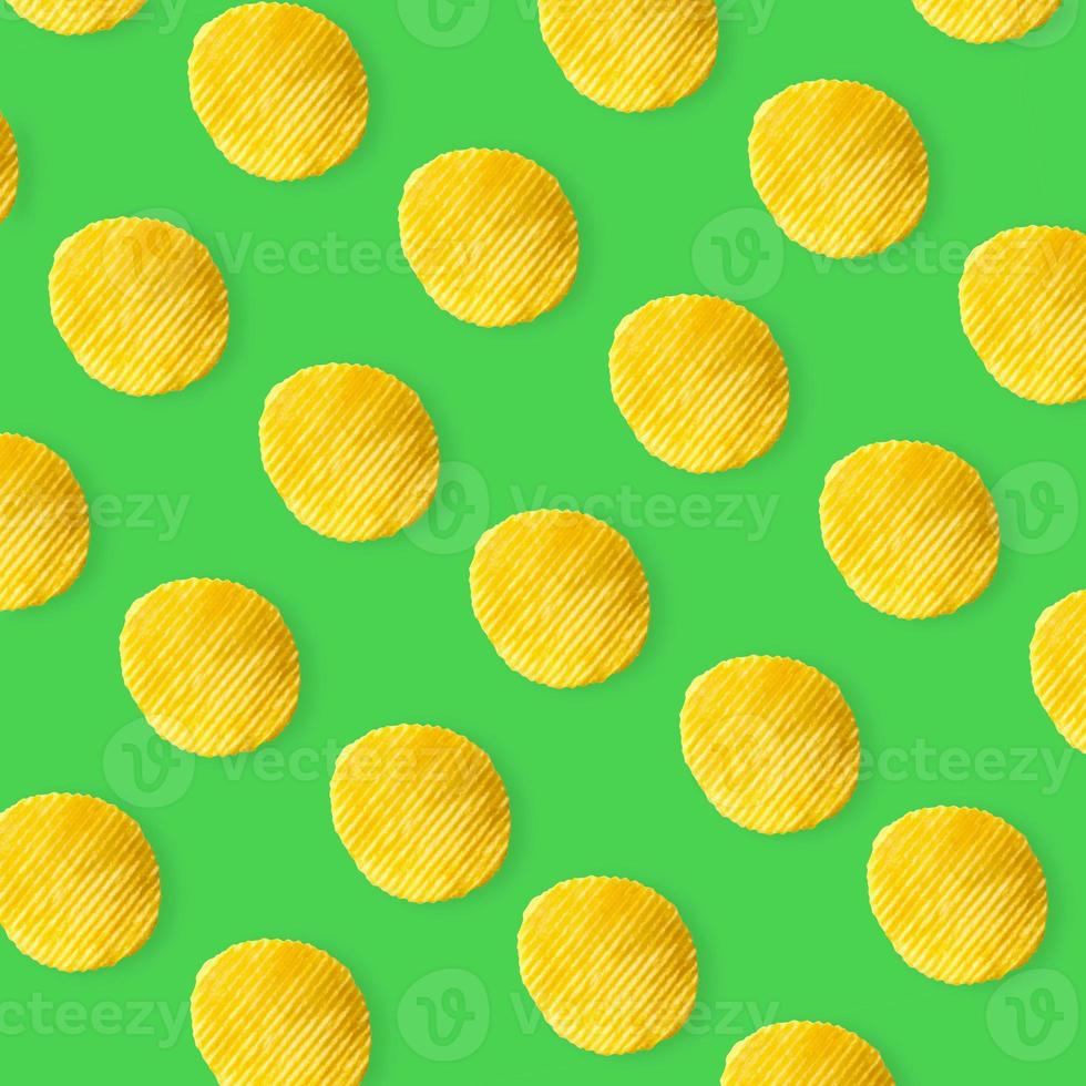 Potato chips pattern on pastel green background top view flat lay photo