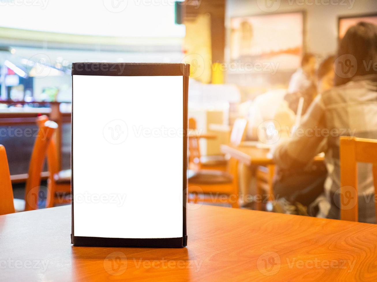 Mock up Blank white menu frame on cafe restaurant table photo