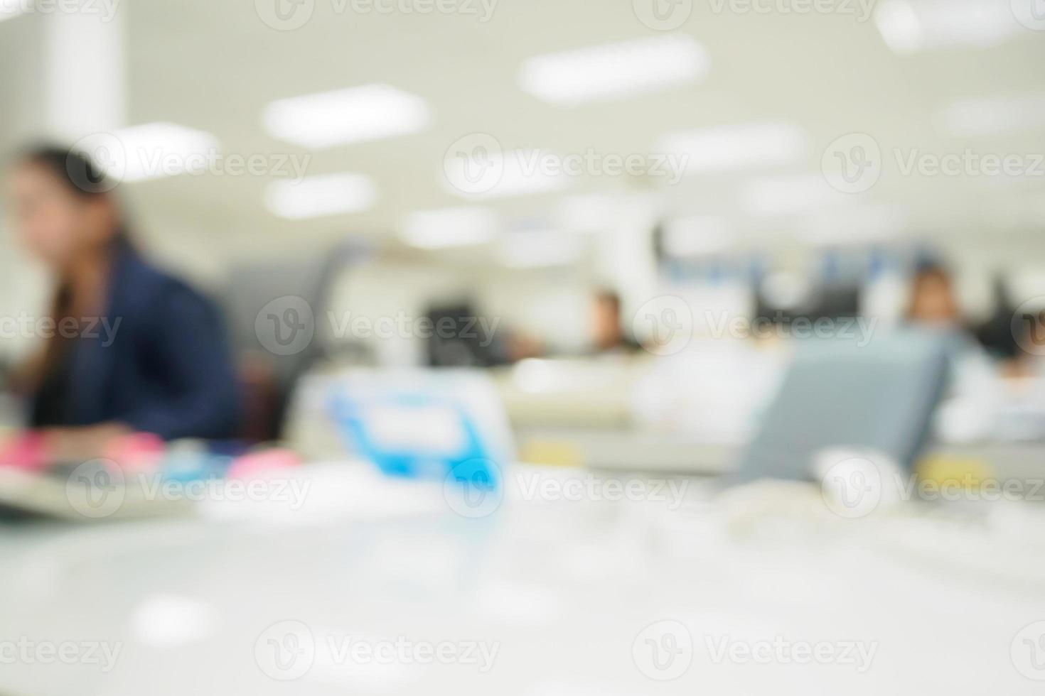 office blurred background with people working at desk photo