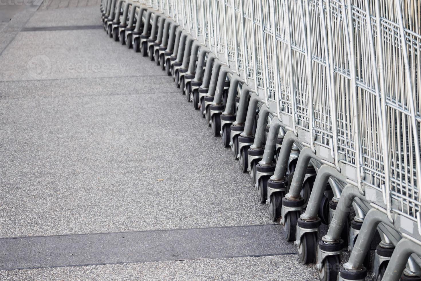 Shopping carts on parking lot photo