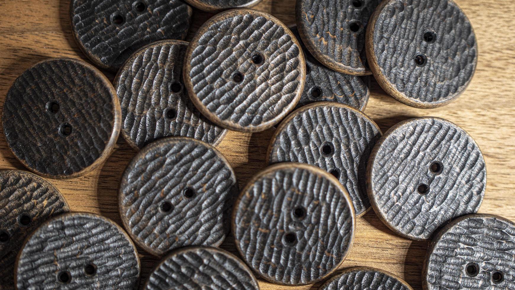 wallpaper wooden buttons with a pronounced handmade texture photo