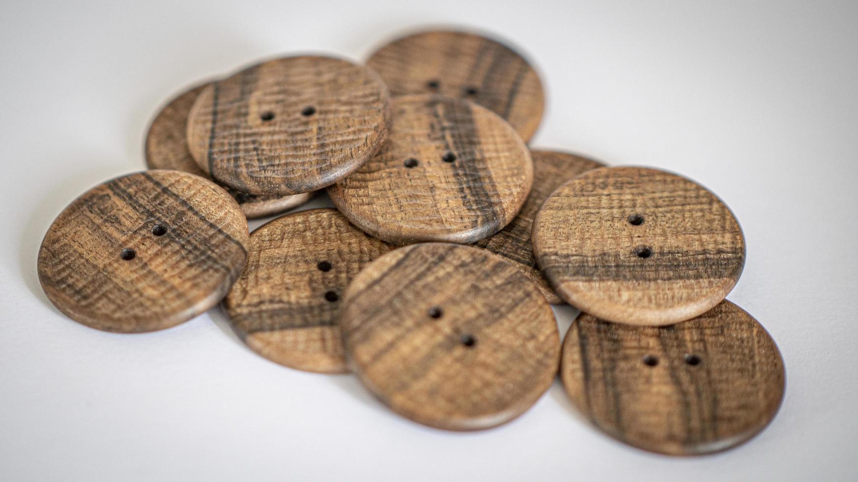 wallpaper walnut wooden buttons with a pronounced handmade texture