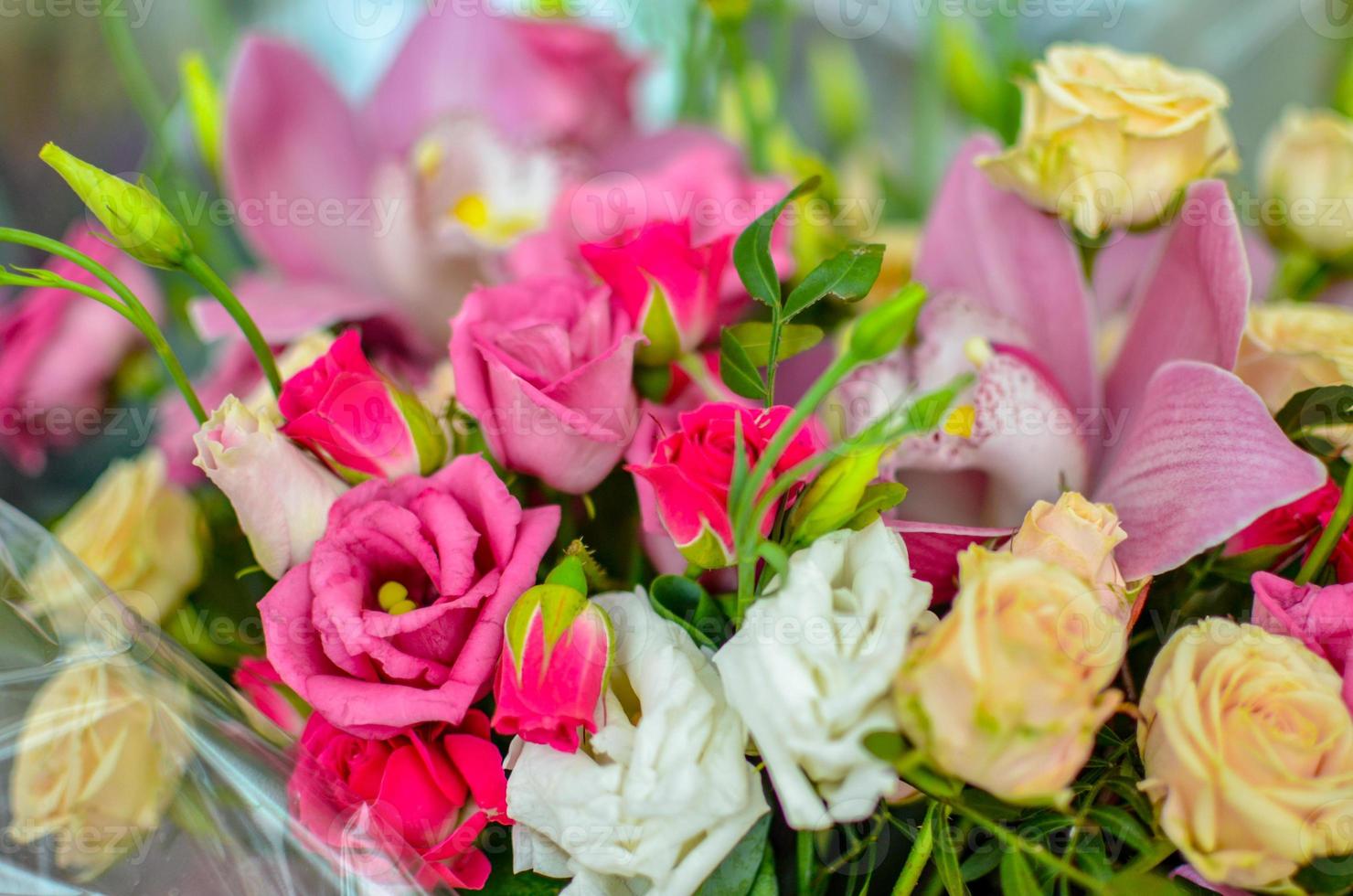 Bouquet with orchids and roses on a beautiful background photo
