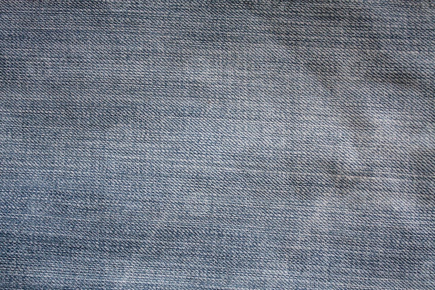 Texture of blue jeans background photo