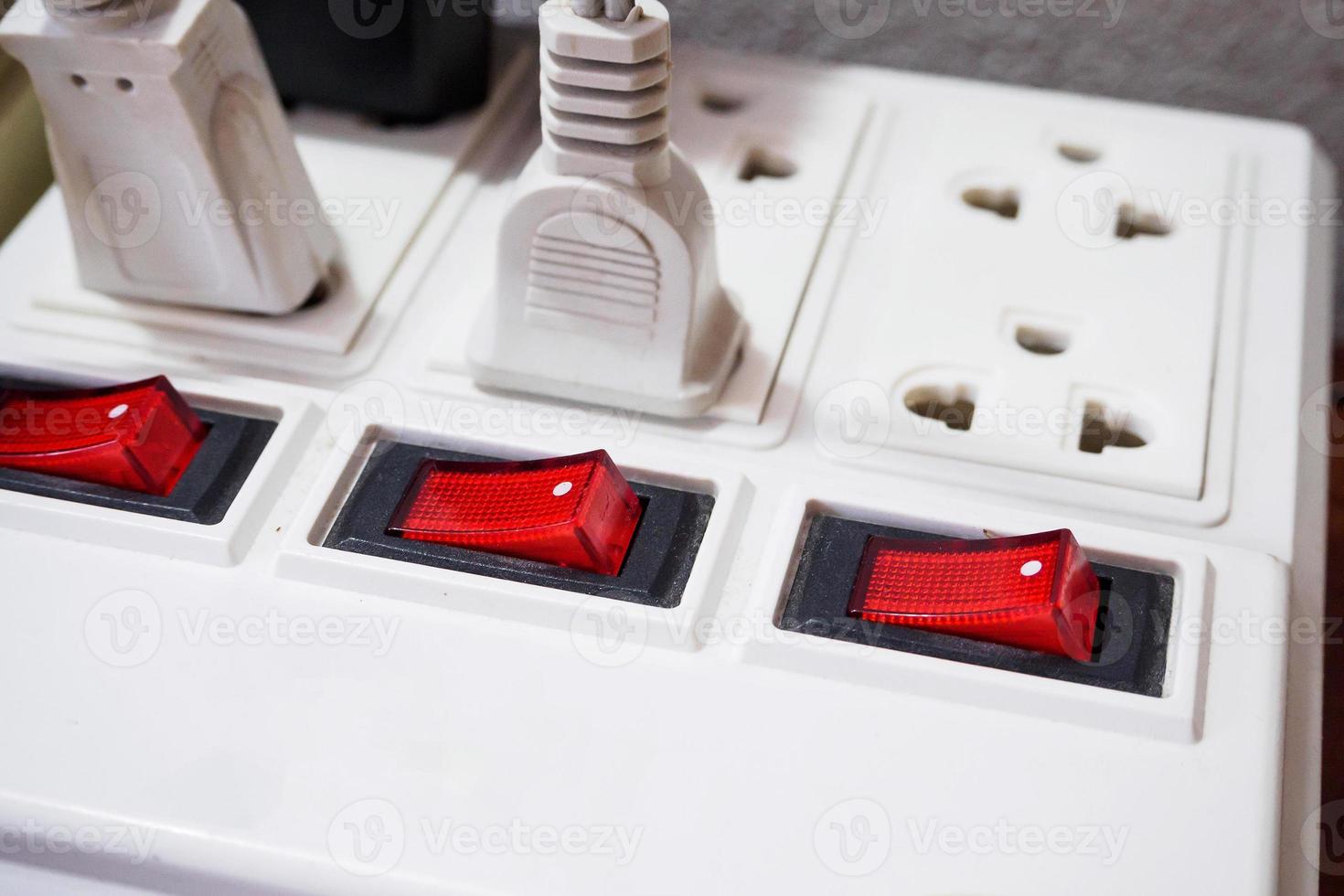 Multiple socket with connected plugs photo
