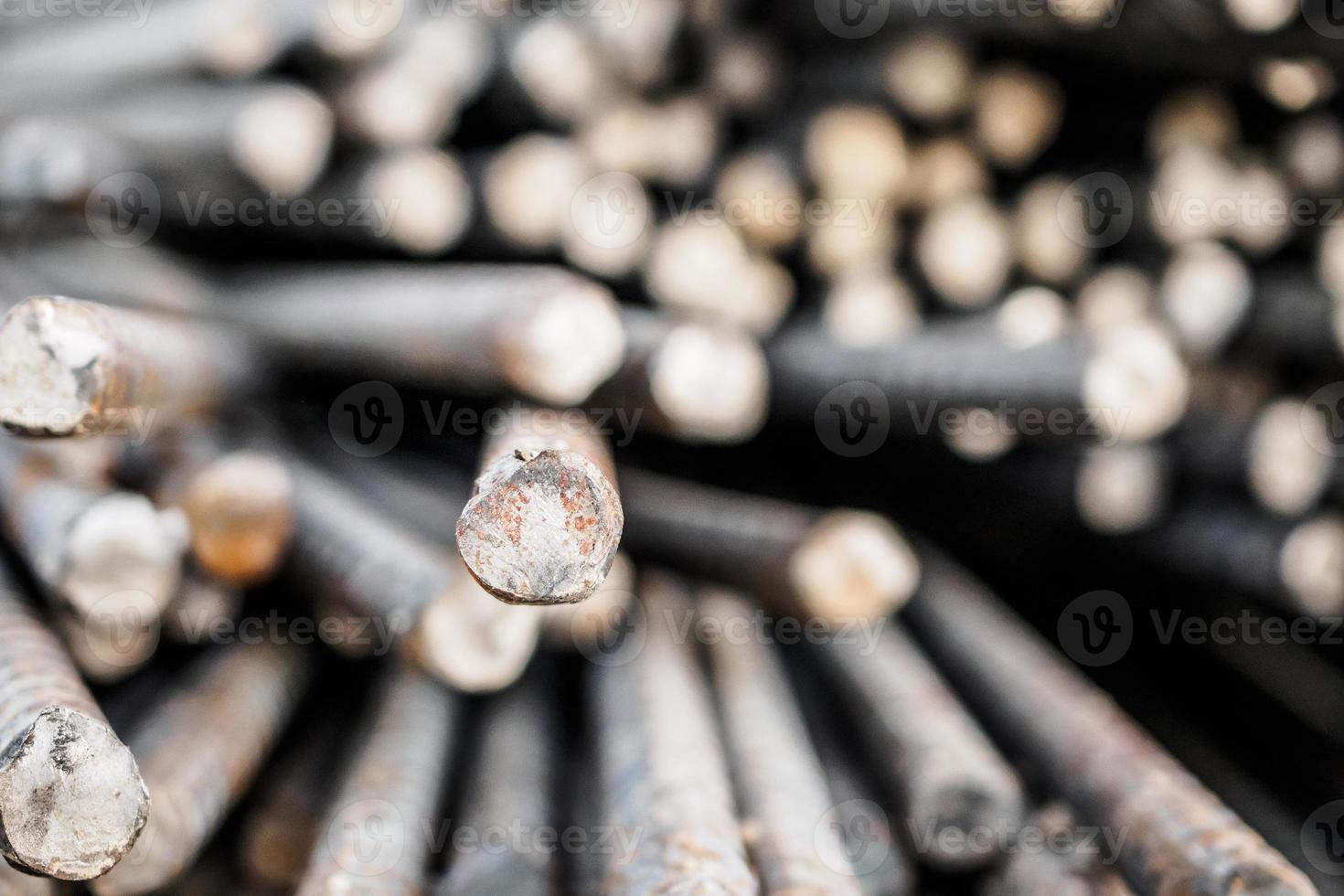 Deformed steel bars metal texture close up photo