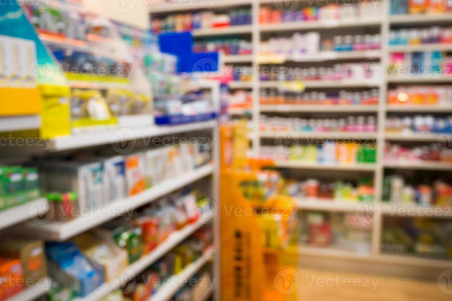 Pharmacy drug store interior blurred background with medicine on shelves photo