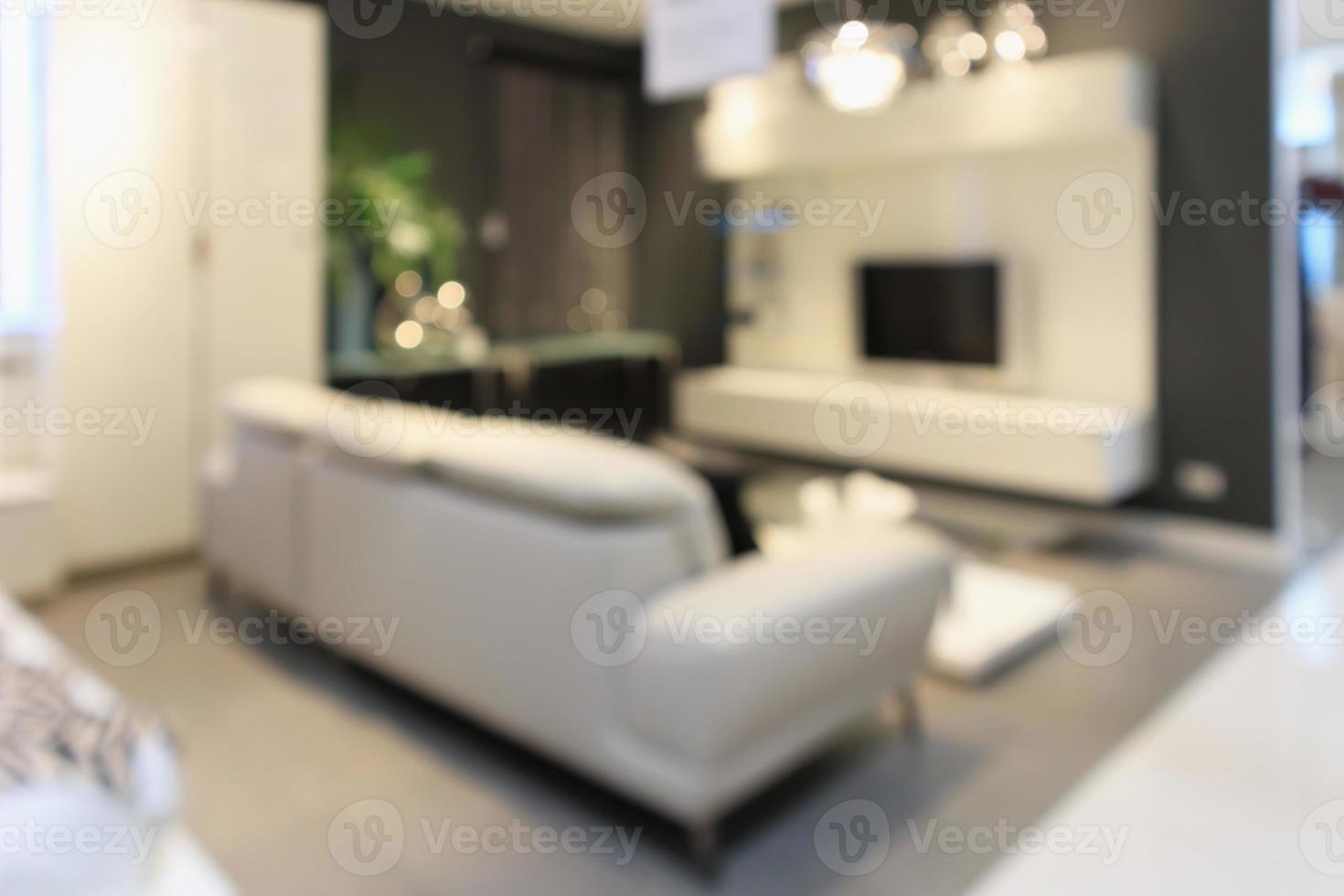 living room interior in furniture store blur background photo