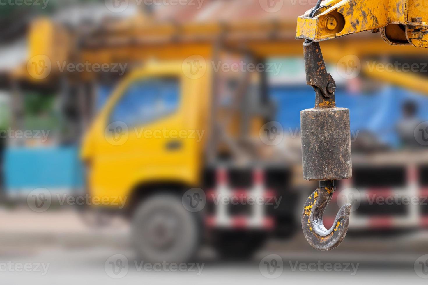 cranes hooks hanging over crane truck background photo