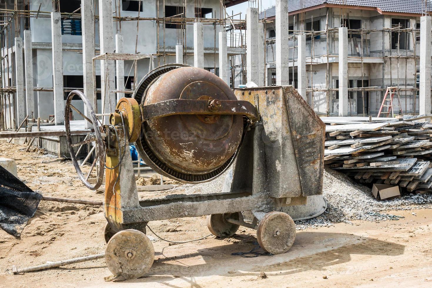 cement concrete mixer machine at new house building construction site photo