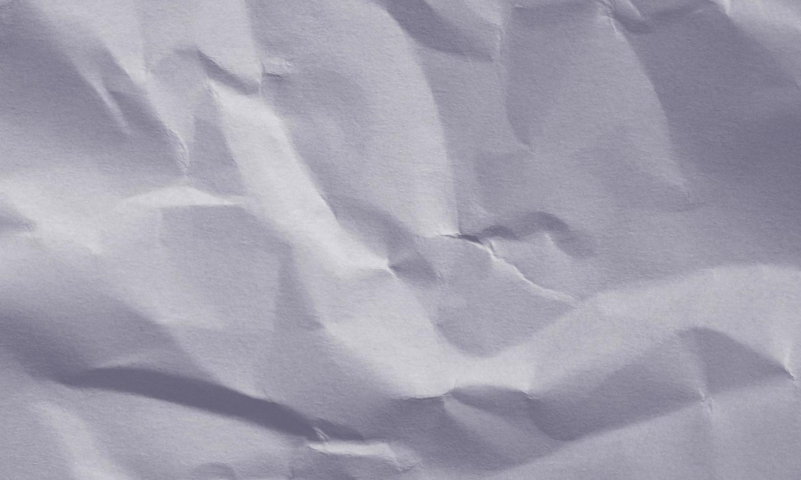 deep navy blue colored crumpled paper texture background for design, decorative. photo