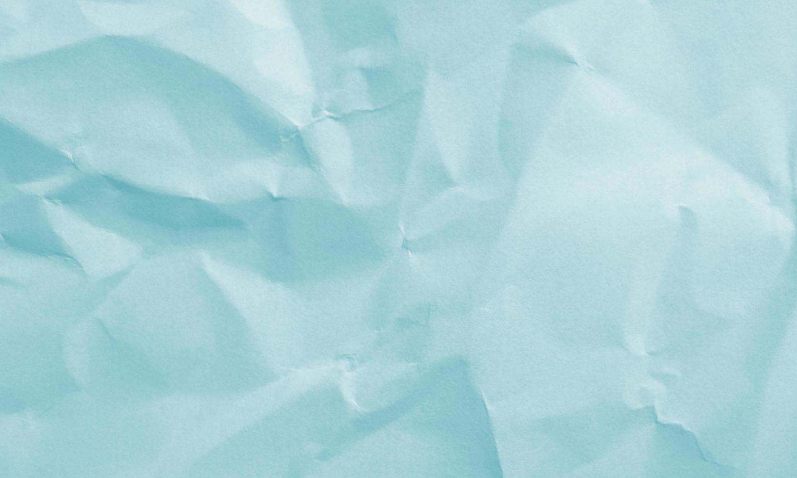 sea green colored crumpled paper texture background for design, decorative. photo