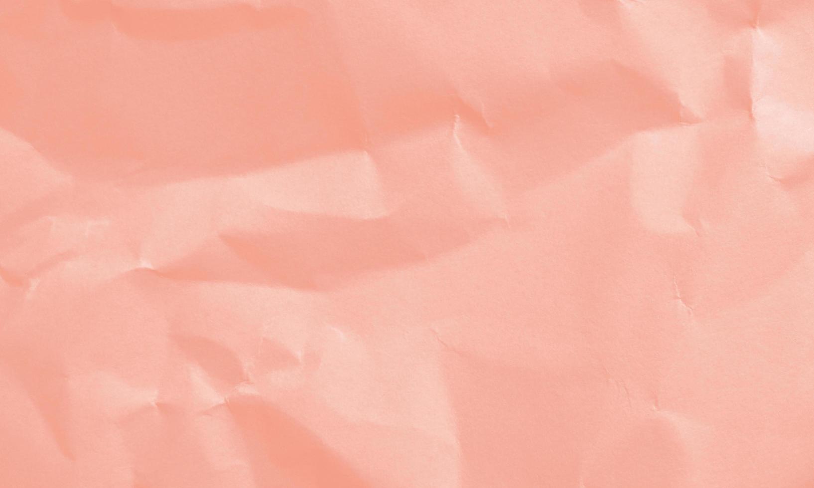 fondo de textura de papel arrugado de color mandarina tango para diseño, decorativo. foto