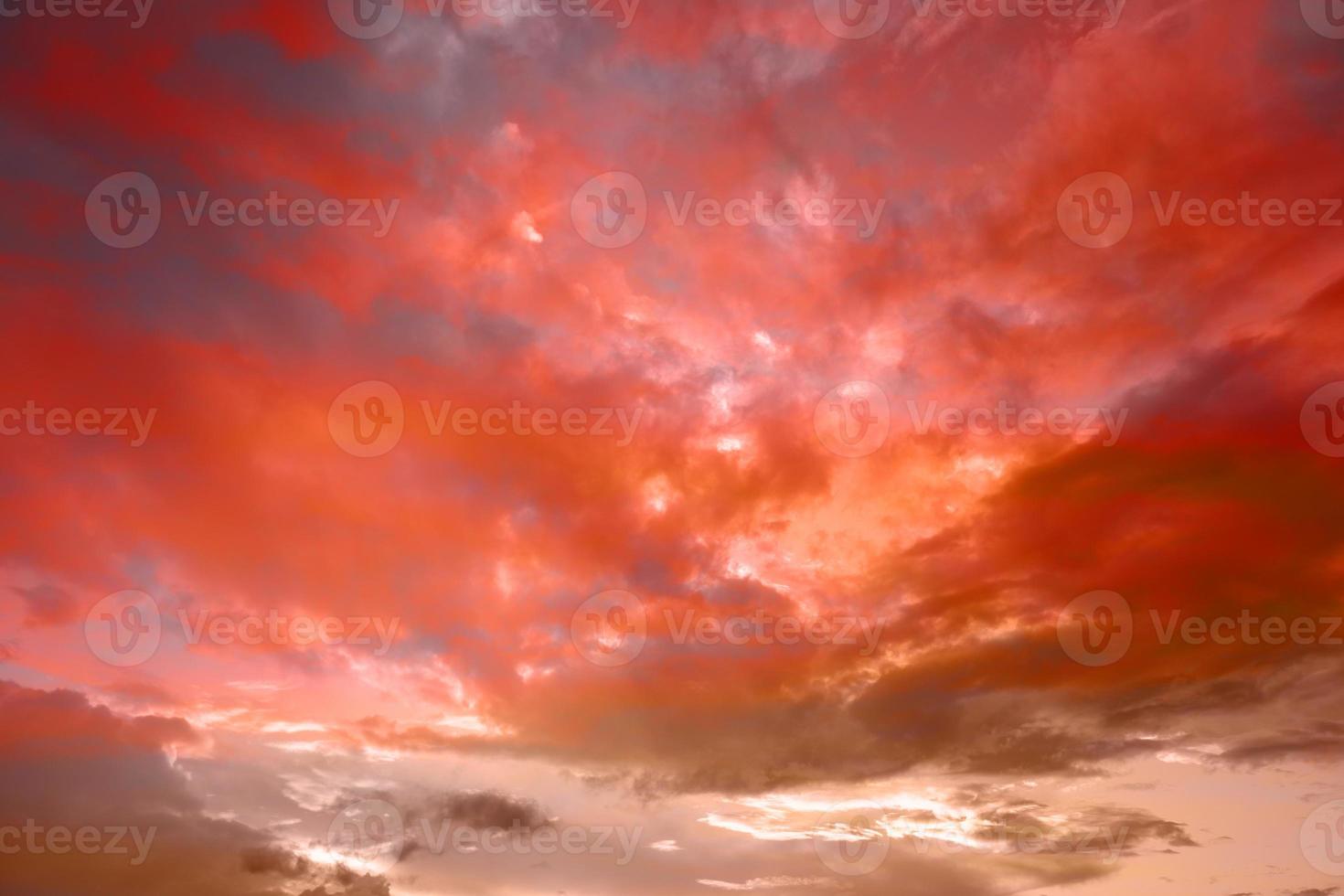 Red sky background. Nature background. Dramatic clouds on the sky in red colors photo