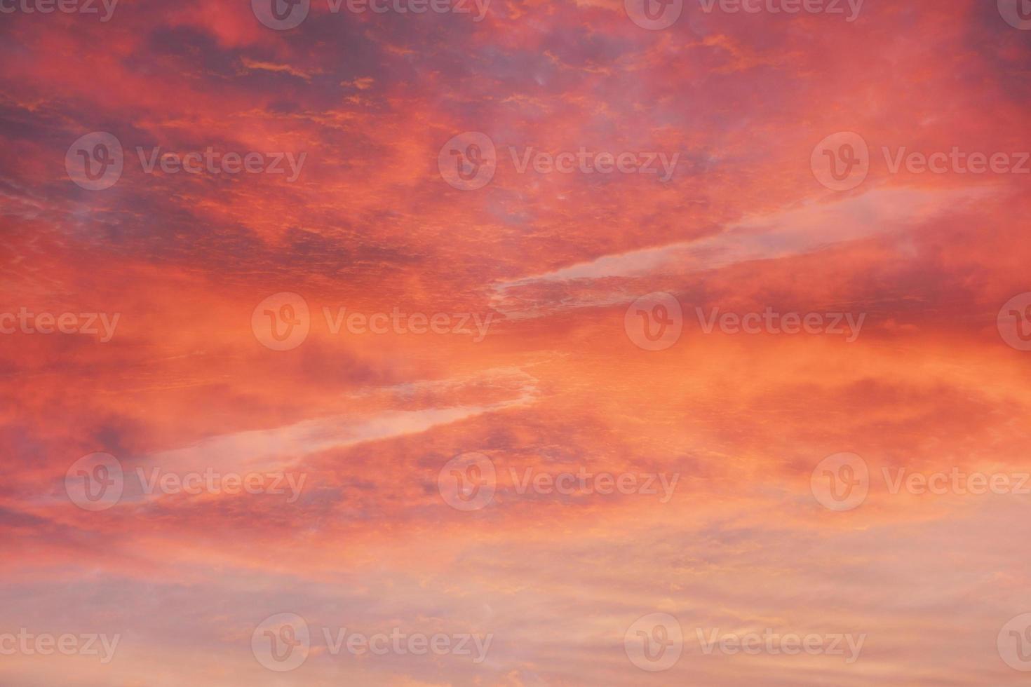 Red sky background. Nature background. Dramatic clouds on the sky in red colors photo