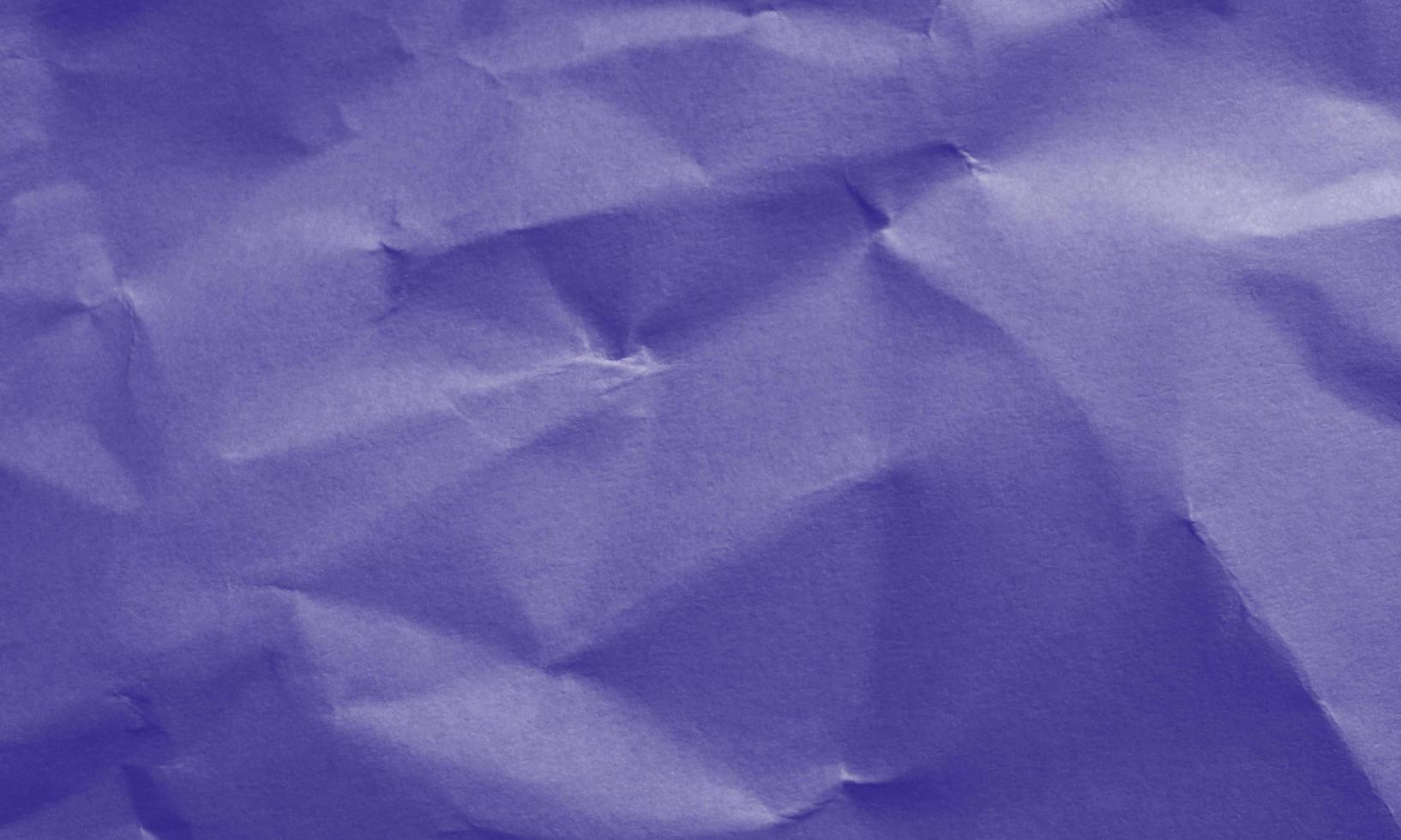blue colored crumpled paper texture background for design, decorative. photo