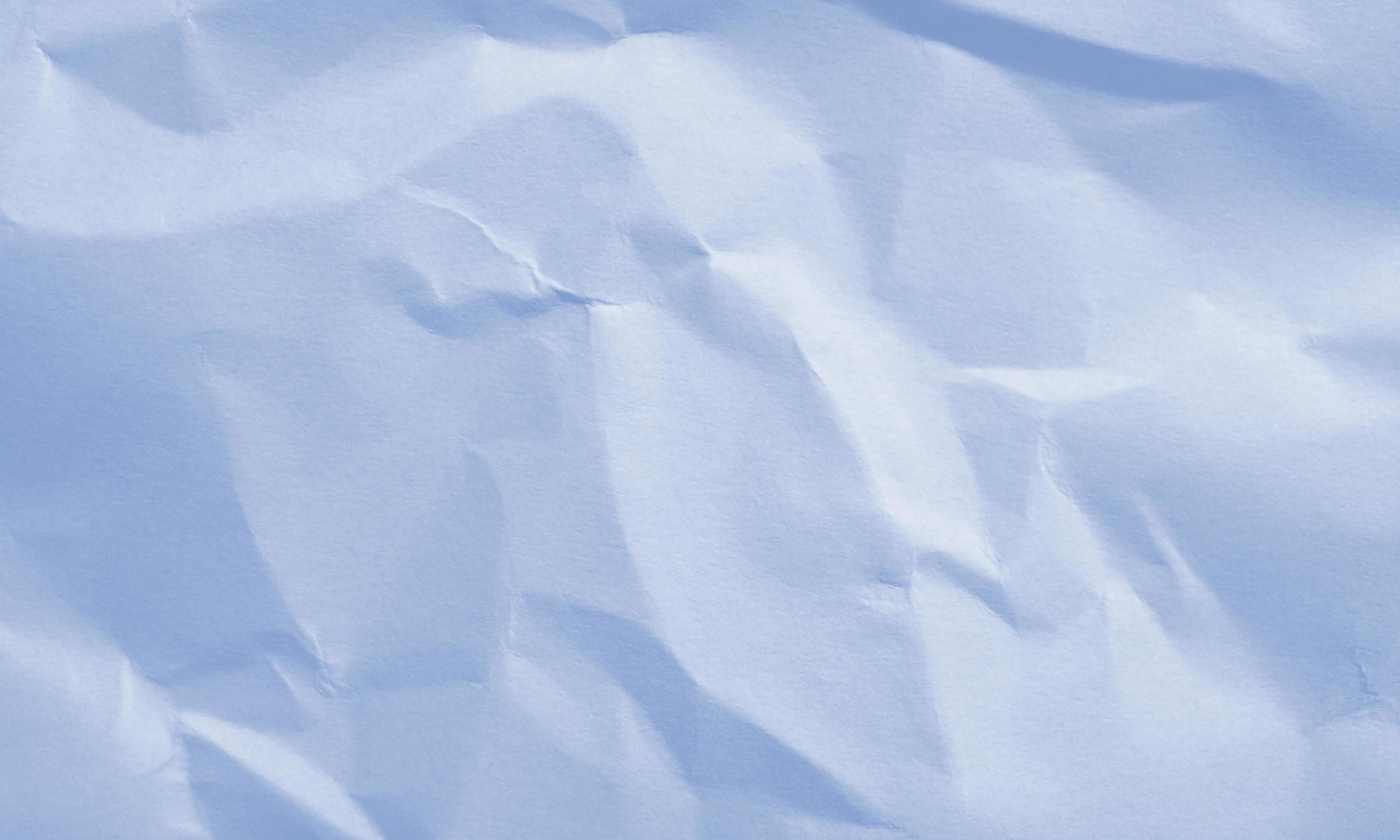 baby blue colored crumpled paper texture background for design