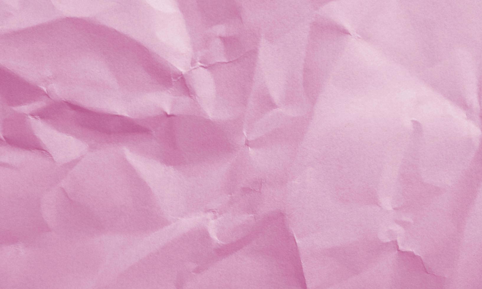purple colored crumpled paper texture background for design, decorative. photo