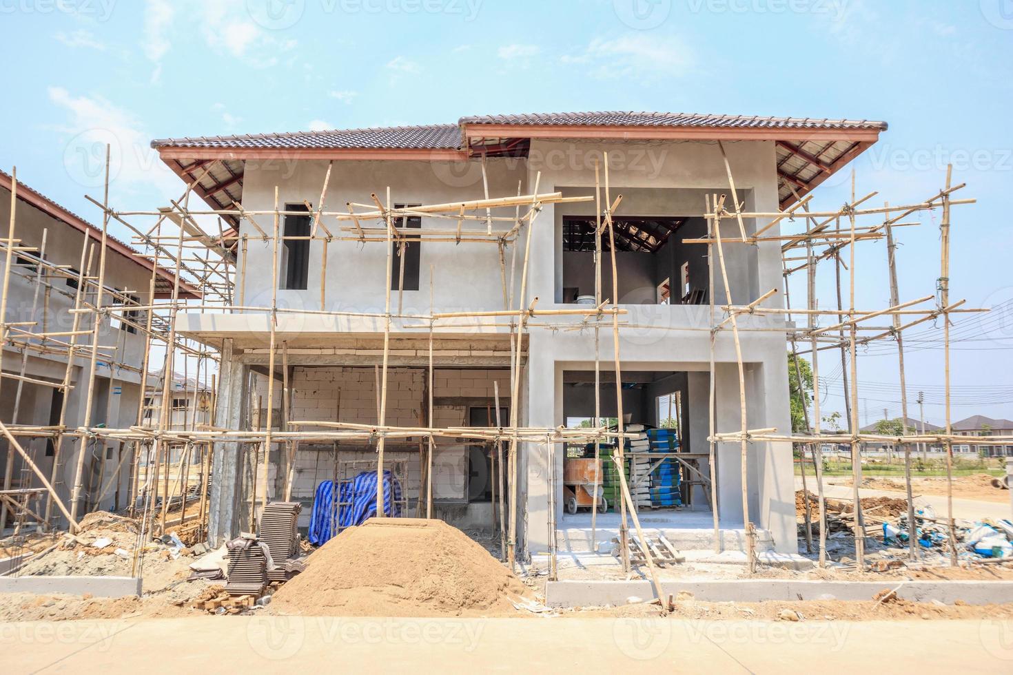 house under construction with autoclaved aerated concrete block structure at building site photo