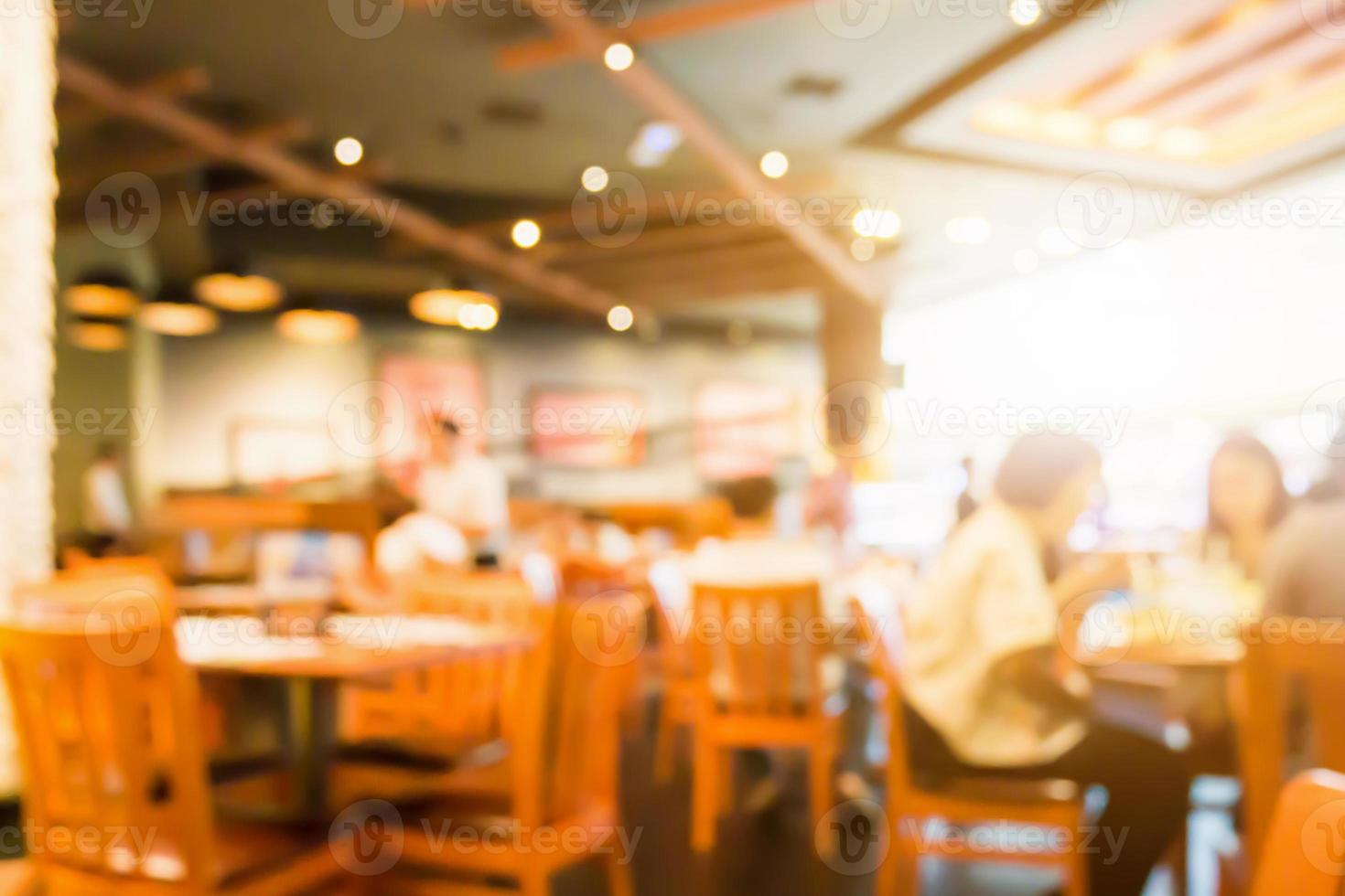 Abstract cafe coffee shoop restaurant blur background with bokeh light photo