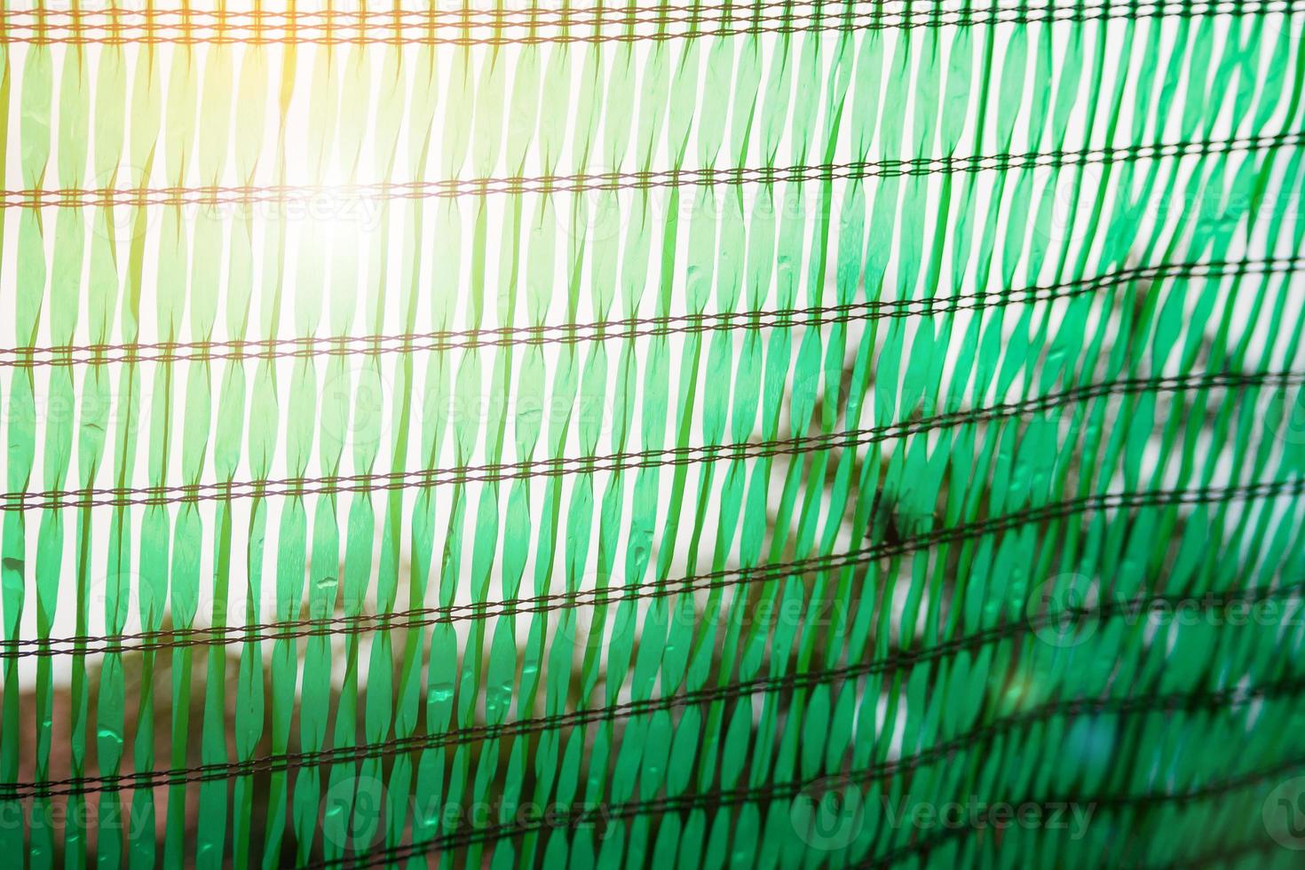 Green Shading Net for protect sun light with tree leaves shadow photo