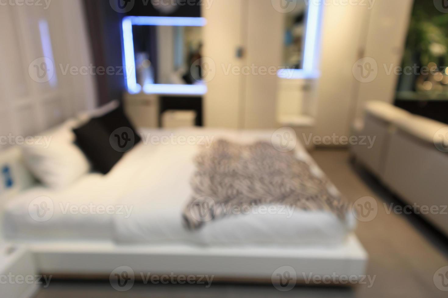 abstract blur bed room in furniture store background photo