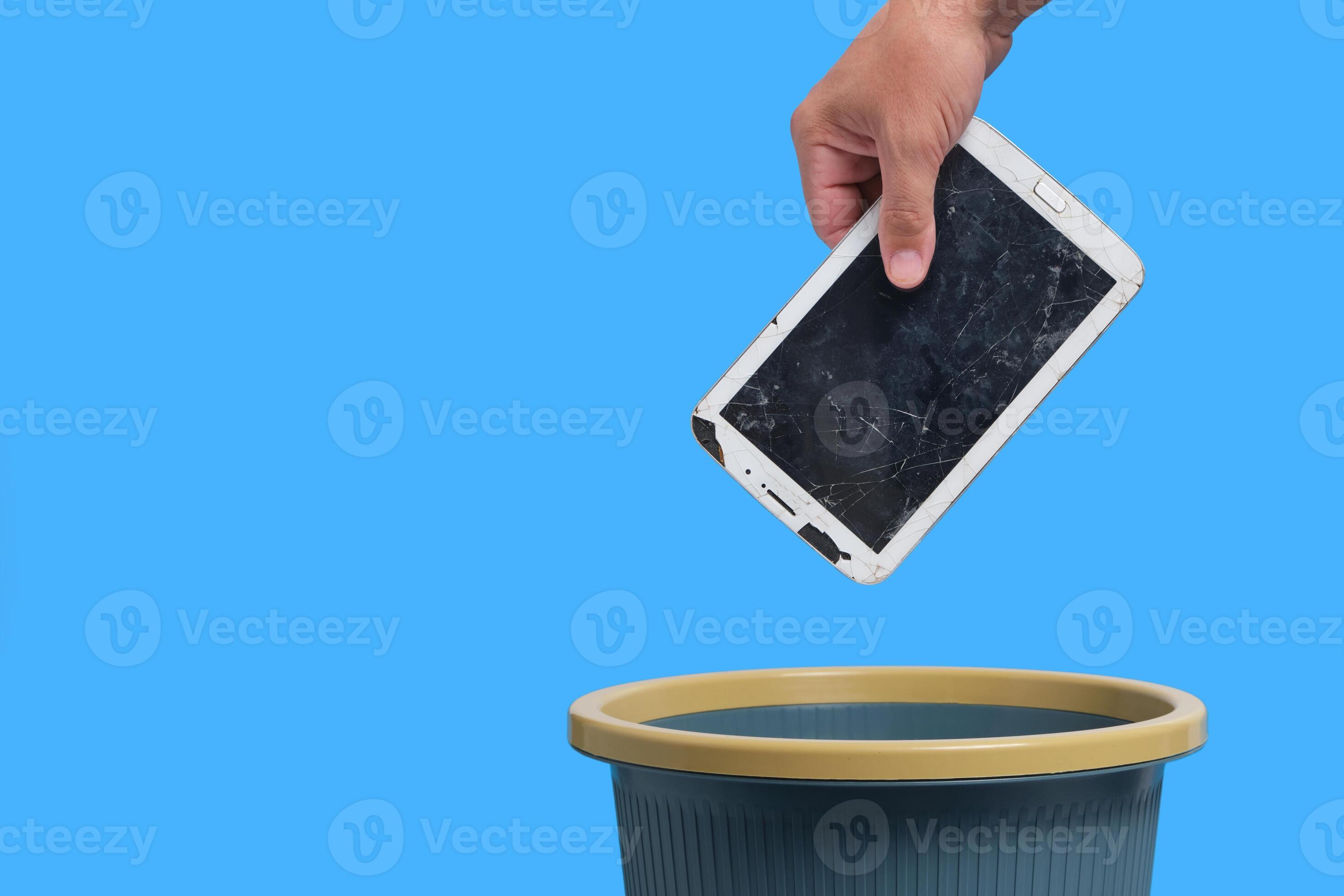 Old android tablet that has failed is thrown into the trash, recycling