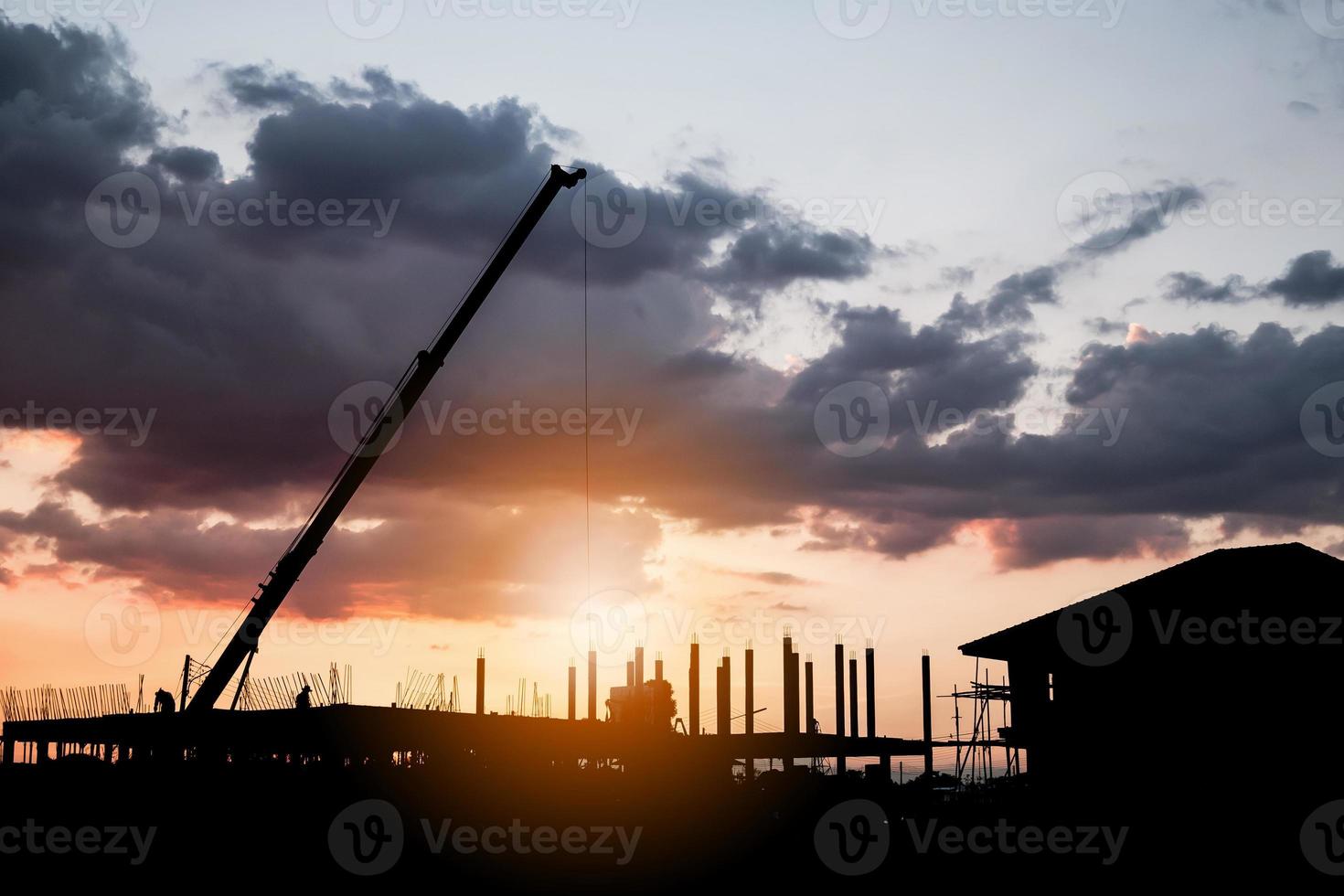 silhouette house building at construction site sunset background photo